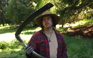 Video of Lyle cutting grass with a Scythe
